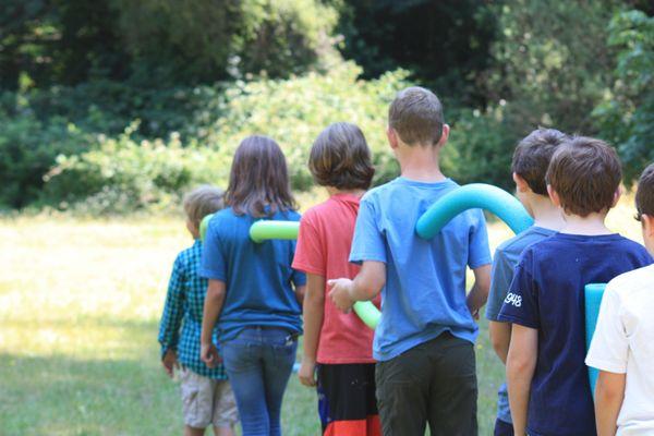 Campers during an intense low ropes game