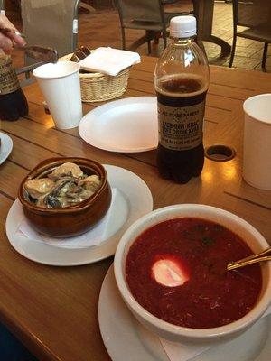 Delicious borscht and meat dumplings baked in a sour cream and mushroom sauce