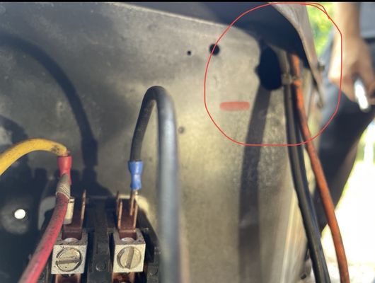 Crimp wires that should have went through the access point  circled in red.