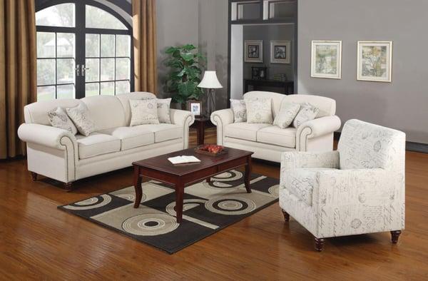 Fabric sofa and love seat with accent writing in cursive on the pillows. available at Comfy Furniture