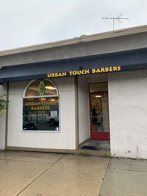 Here is the front of a great barber shop. All are welcome.