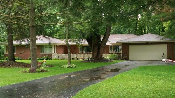 THIS ALL BRICK HOME IS SITUATED OFF THE ROAD ON 5 WOODED ACRES BACKING UP TO THE HORSE TRAILS!...