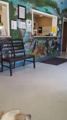 Waiting room, we were told the beautiful mural of the animals were their past and present customers.