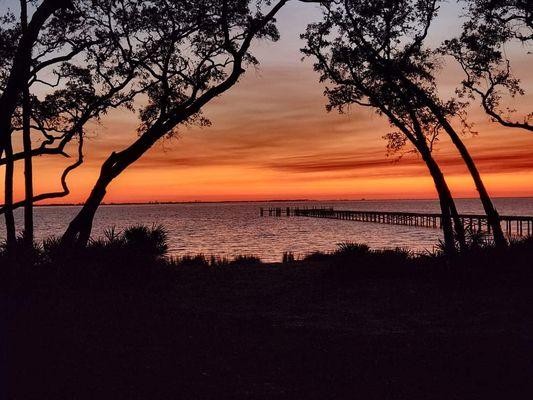 Sunset over Choctawhatchee Bay and the Hammock Bay pier.