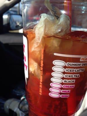 What I saw after a few sips of my plain iced tea purchased at this location's drive-thru. DISGUSTING! Manager could care less.