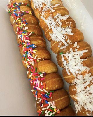 Sprinkles & coconut donuts with dulce de leche