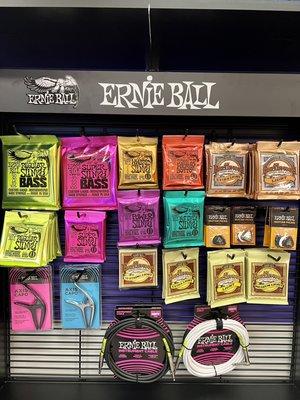 We now carry Ernie Ball strings, picks & gear!