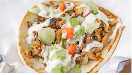 Combo Gyro:
Grilled Chicken, 
Lamb and Salad in toasted pita topped with homemade Taziki sauce (White Sauce)