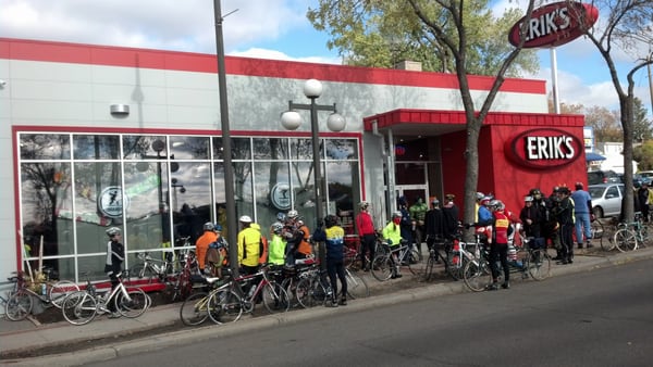 Twin Cities Bicycling Club Members stop for a break at the shop during their annual Halloween Ride.