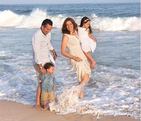 A family beach photography session and then the waves come up when the family does not expect it.