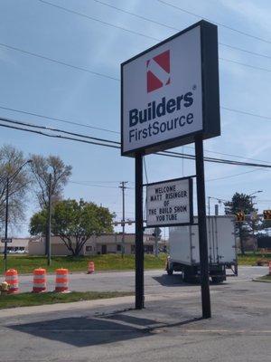 Builders FirstSource building materials showroom in Clinton Township, MI street sign.