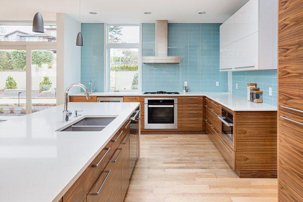 Modern Kitchen Inspiration
 Laminated Cabinetry, Glass 
 Backsplash to Ceiling, 
 Quartz Countertop and Hardwood Floor