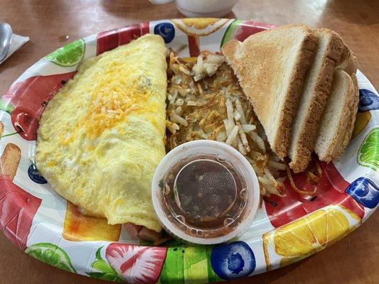 Ham an cheese omelet wit hash browns, salza an toast...on a paper plate