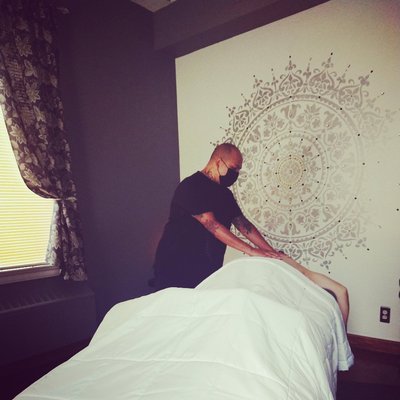 L.M.T. Gerardo Martinez in therapy room.