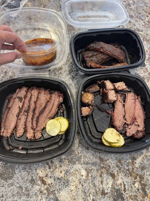 1/2 lbs of brisket. Two meat combo with beans and a side of 4 ribs. $68.