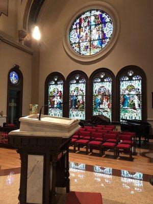 The marble floor was polished to a shine where you can clearly see the stain glass reflections.