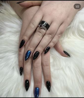 Silhouette nail with black and blue chrome nails