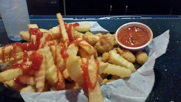 Popcorn shrimp with fries.