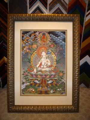 This is the Tantric Buddhist deity known as White Tara by a Nepalese artist.