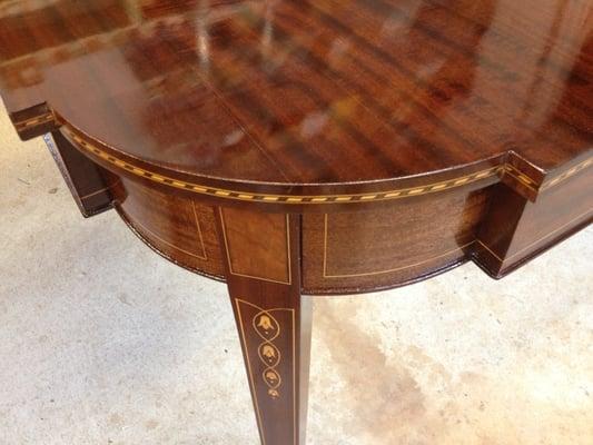 A beautiful French polish on this inlaid dining table