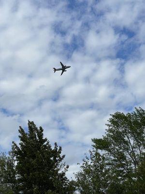 Airport nearby and plane taking off.