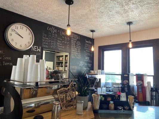 Coffee bar - chalk wall shows the drinks available, the menus are on the counter