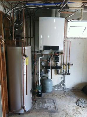 High efficient wall hung Buderus boiler with indirect hot water tank.