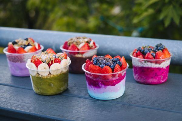 Combination of beautiful bowls! From left to right  UBE, Matcha, Acai, Pitaya, the layered one is blue Majik ,Ube, and pitaya!