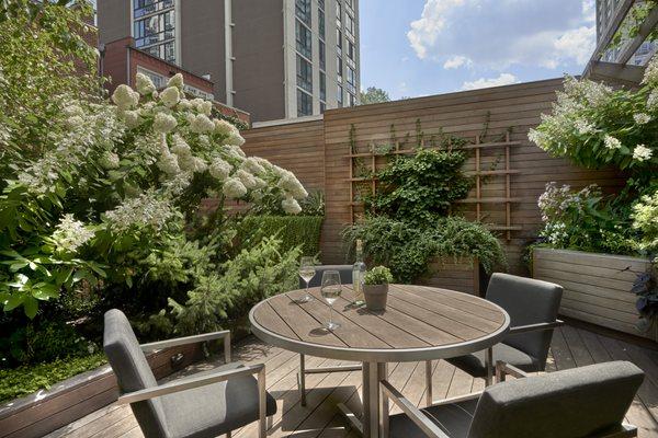 Perennials and annuals add a beautiful effect to this rooftop terrace