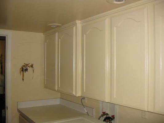 custom sprayed laundry room cabinets-oil enamel.