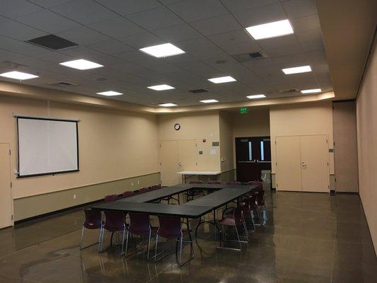 One of the three meeting rooms, set up for a small meeting.