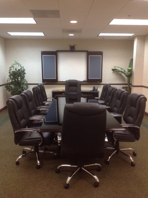 Large Conference Room, able to accommodate up to 12 people.