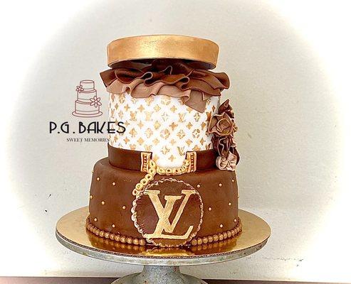 Elegant LV cake made of Red Velvet and chocolate filled with strawberries and smooth chocolate buttercream.