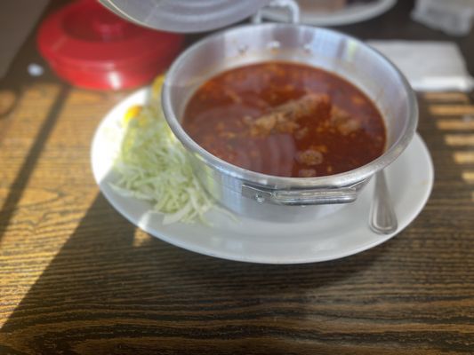 Posole served in a cute pot