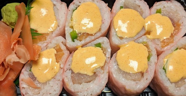 Pink Lady Roll: Salmon, yellowtail, tuna, and jalapeno w/ chef's special sauce