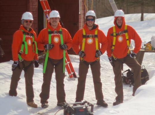 Fully equipped with the required safety equipment our installation crew prepares for a commercial roof mounted project.