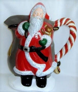 Santa pitcher.  Hand-painted ceramic Santa pitcher.  Glazed on the inside for your holiday use.  Hand wash.