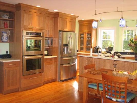 This kitchen was reorganized to take advantage of the light from the bow window and add a pantry and a half bath...