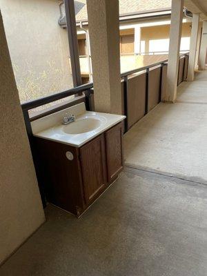 A Sink Left in the hall Over a Holiday Weekend After Renovating the Unit of a Deceased Neighbor. May she Rest In Peace.