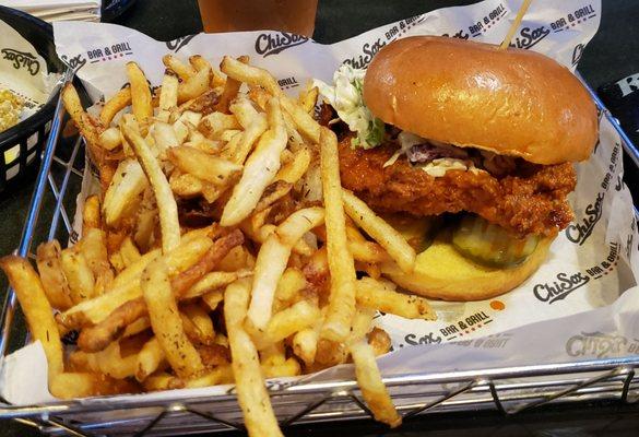 Buffalo fried chicken sandwich ($14) with coleslaw, pickles, and seasoned hand-cut fries