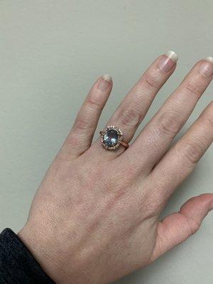 Rose gold engagement ring with aquamarine stone.