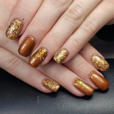 Structured gel manicure with chunky  glitter accents