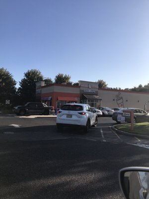 The huge drive-through line which shows you that people love Dunkin' Donuts because they are willing to wait