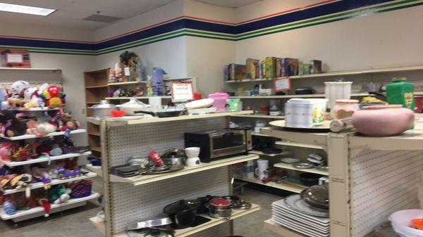 Back left of store with dishes/toys