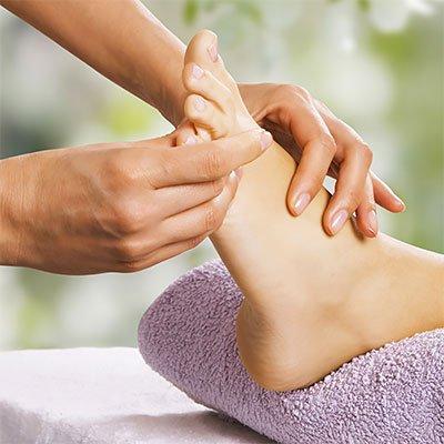 Reflexology is an alternative treatment involving application of pressure to the feet that effects a positive physical change to the body.