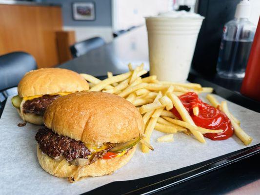 Motz's fresh beef cheeseburger sliders, shoestring french fries and vanilla milkshake.