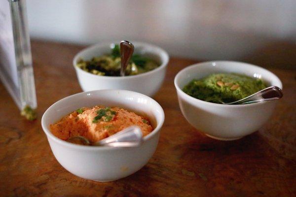 Three dips: pimento cheese; artichoke-olive tapenade; green garbanzo mint pea hummus. Photo credit: Angie Lyons