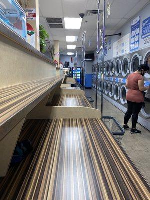 Laundry folding station and dryer area