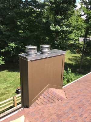 Newly installed MFG lifetime warranty stainless steel chase lid on sided chimney.