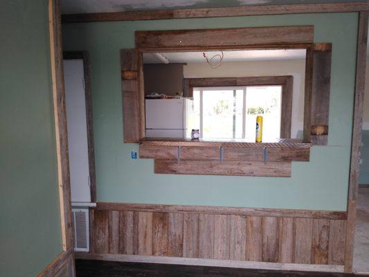 Bar being added into wall during home renovation Florida - post Hurricane Michael